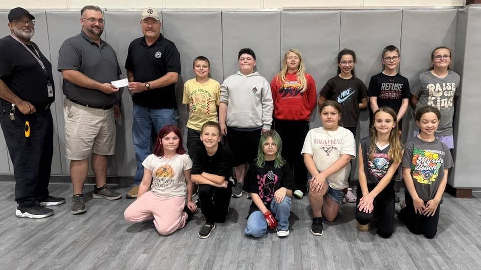 Alderson Archery team members receiving a check from GVSA to help fund Nationals and Worlds competitions