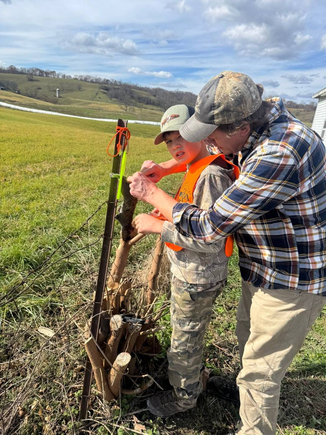 A GVSA volunteer mentoring a young hunter during the Youth Squirrel Hunt